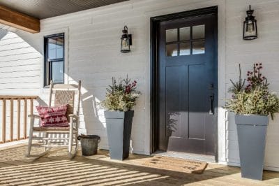 Peaceful home entrance with front door and porch, representing in-home cremation service support