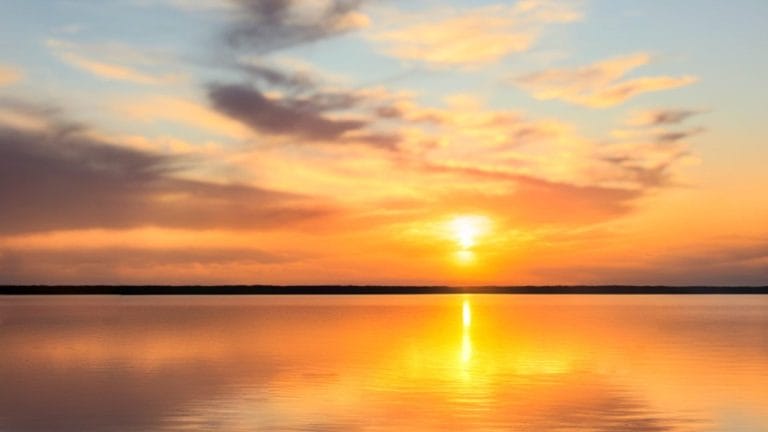 A peaceful sunset over Lake Conroe reflects the calm and clarity families may need when making cremation arrangements.