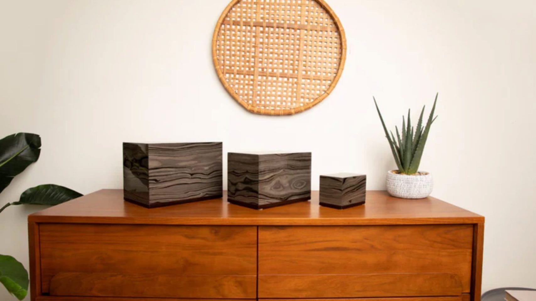 Full size, medium, and small cremation urns displayed together for different memorial needs.