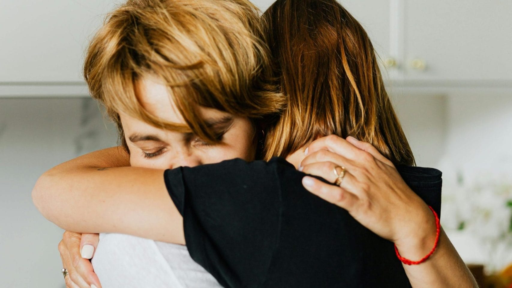 Two family members embracing during a difficult moment.
