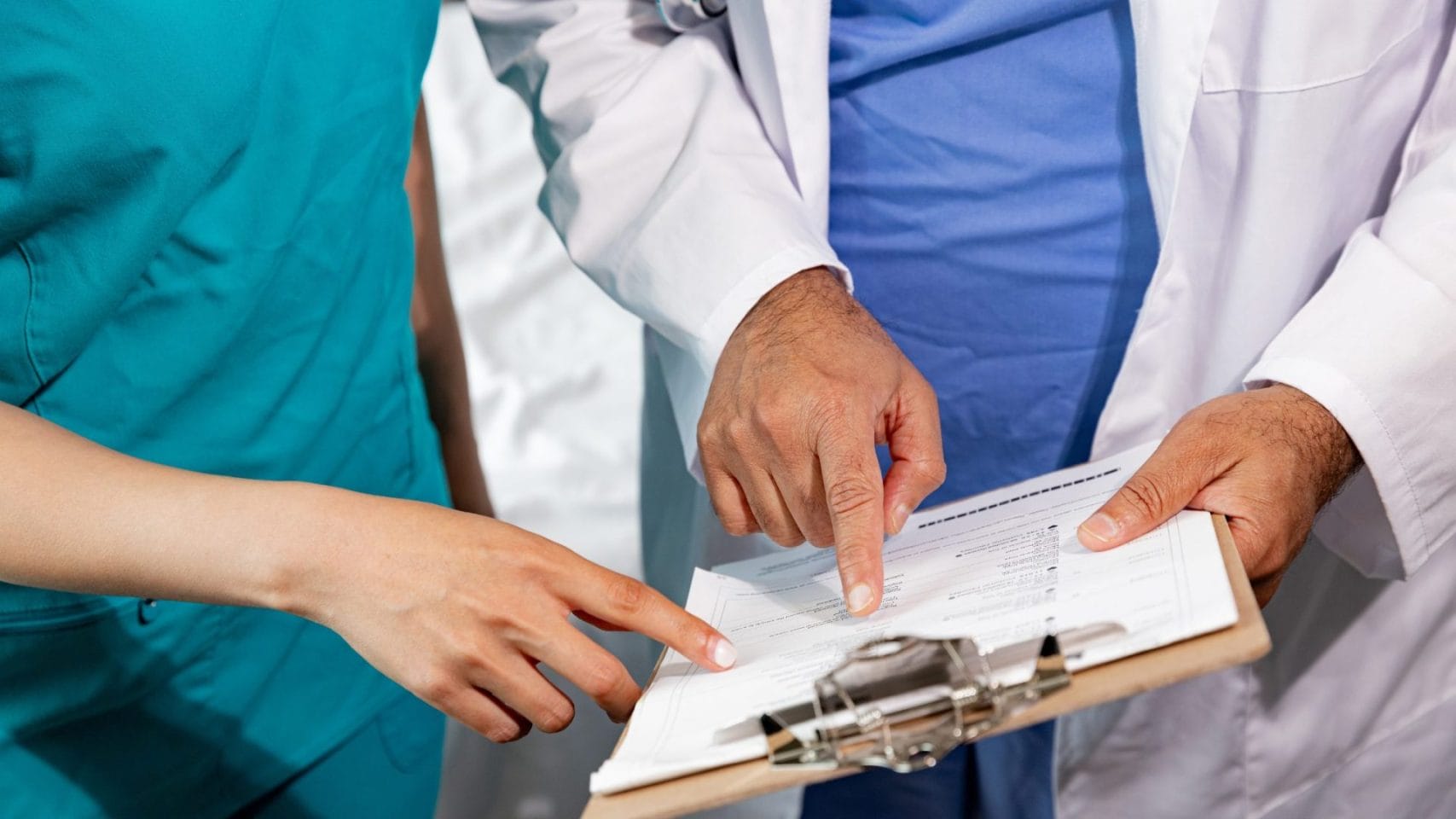 Hospice medical staff reviewing paperwork for next steps after a death.