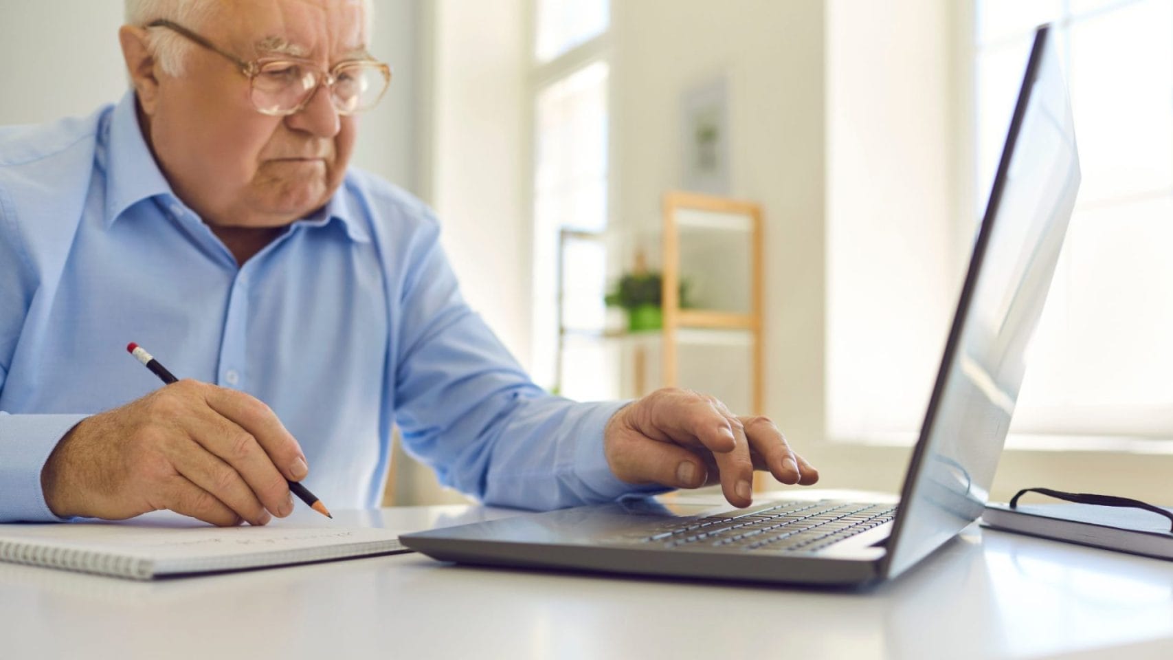 Man planning ahead for cremation costs and final arrangements at home.