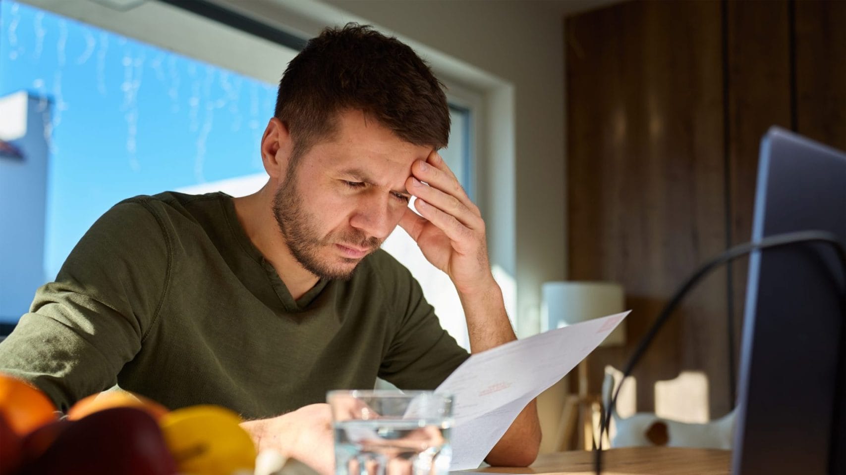 Man reviewing paperwork while preparing for cremation arrangements in Houston.