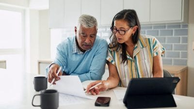 Family reviewing documents needed to start cremation arrangements in Houston Texas