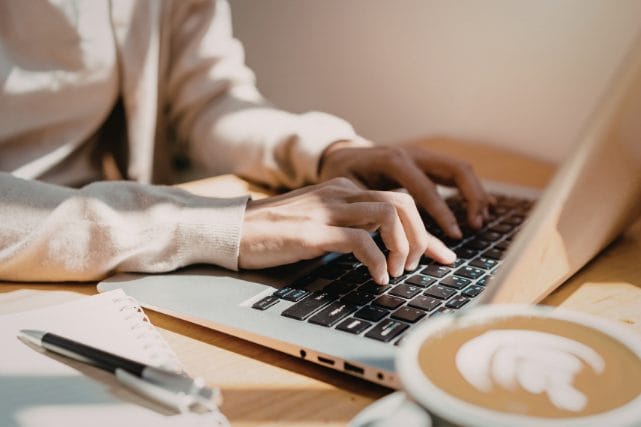 Person reviewing transparent cremation pricing online before calling a provider