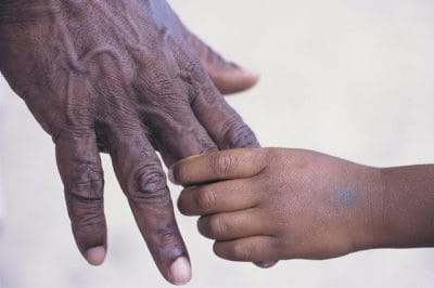 Holding a loved one’s hand during end-of-life care and support