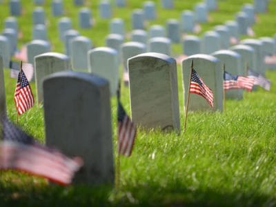 United States National flags and headstones in National cemetery